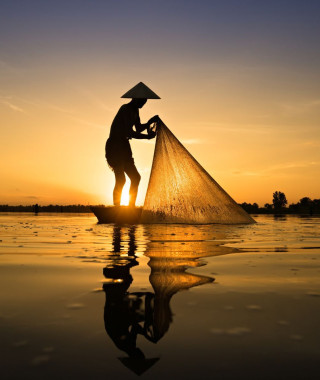 Reisebild - Fischer auf dem Mekong